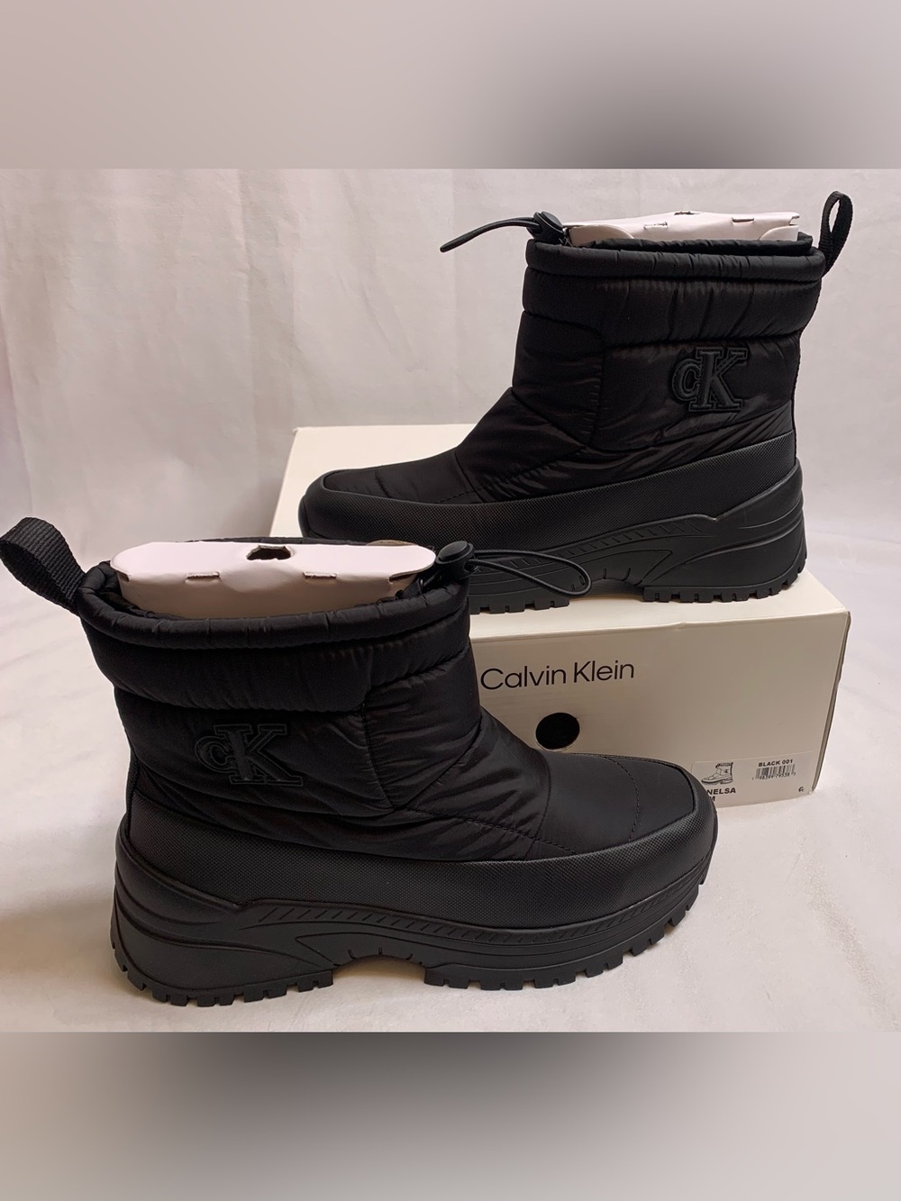 Women’s Calvin Klein Nelsa black quilted boots size 10 casual lug sole bootie